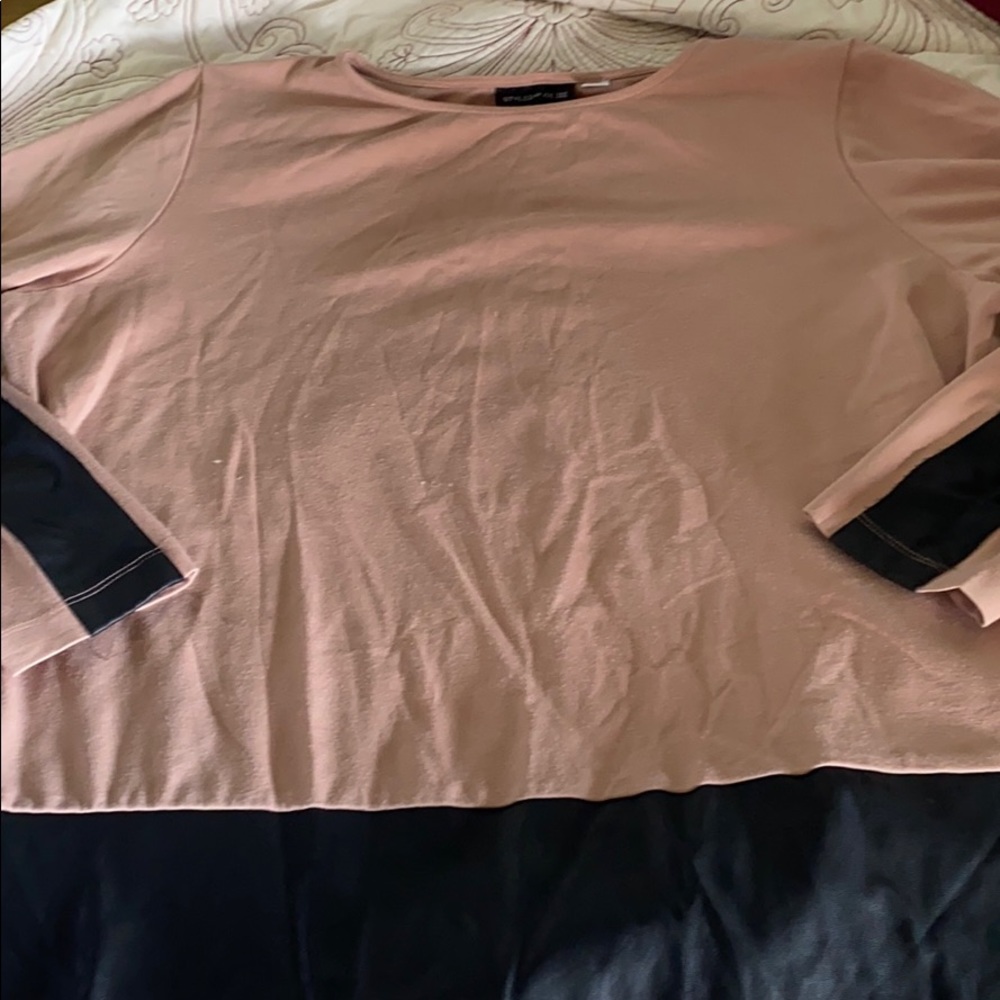 Shirt with leather one the bottom and on the arms